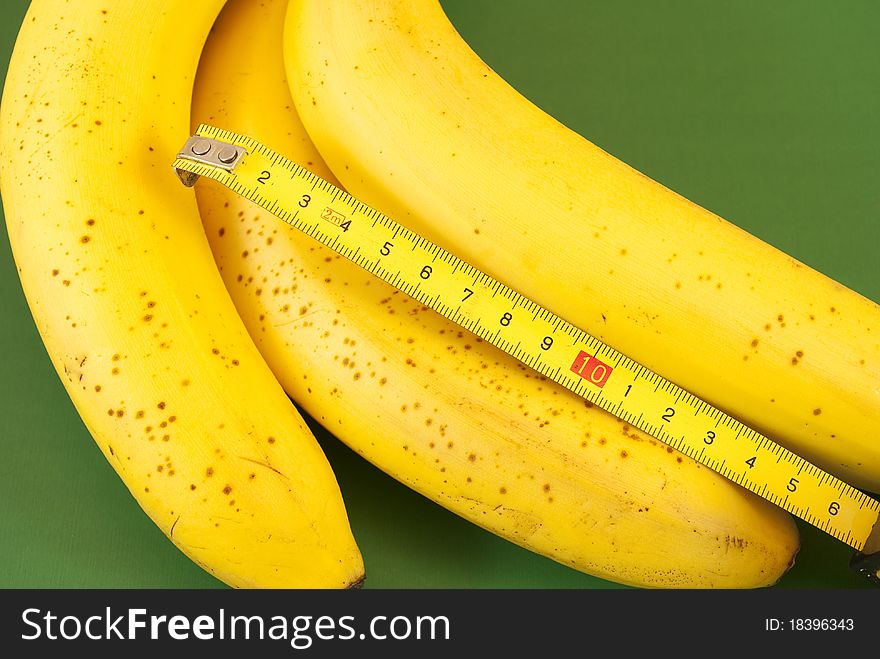 Ripe bananas with tape measure