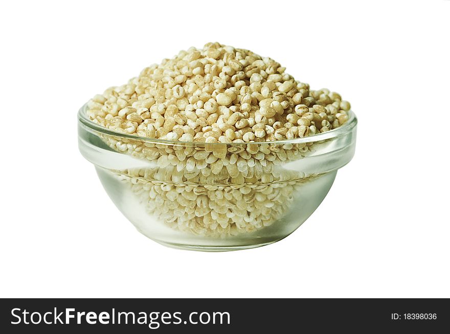 Pearl barley in a glass bowl, isolated