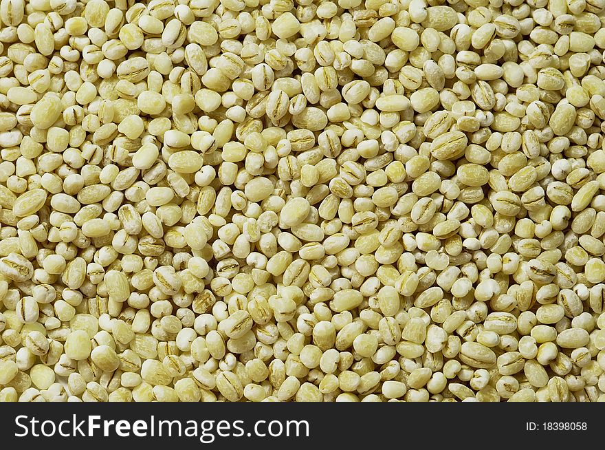 Raw loose pearl barley, horizontal texture, background