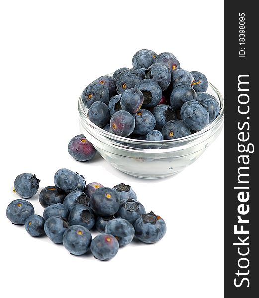 A bowl of fresh blueberries, isolated on a white background. A bowl of fresh blueberries, isolated on a white background