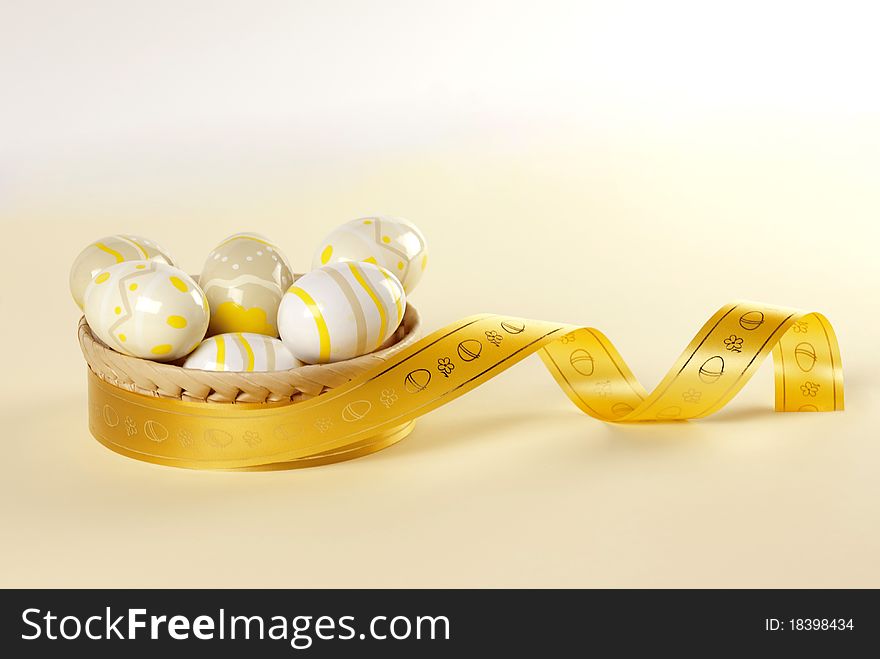 Easter basket, eggs and gold ribbon