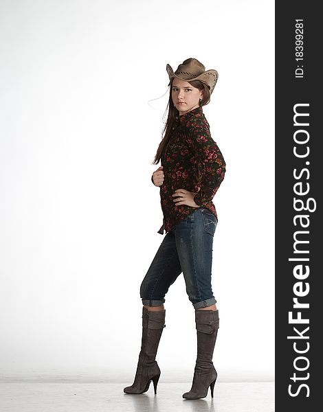 Attractive cowgirl portrait on white background