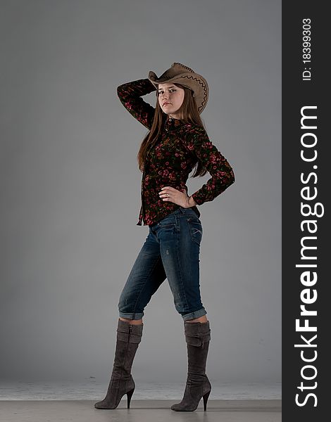 Attractive cowgirl portrait on white background