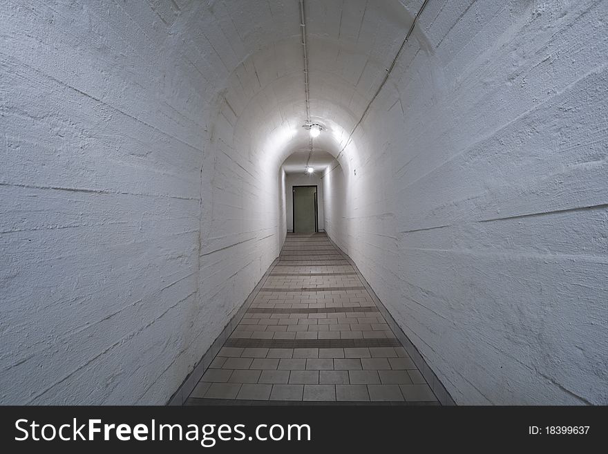 Narrow corridor in old underground hospital.