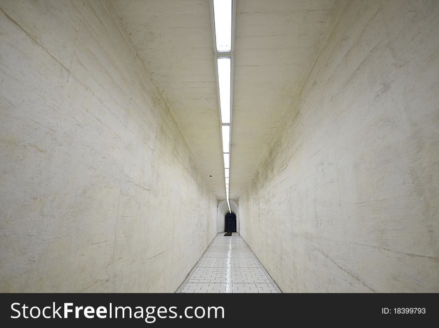 Narrow corridor in old underground hospital.