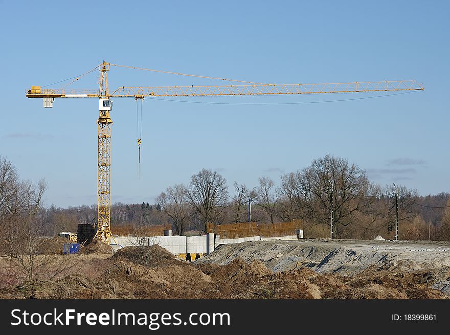 Lonely crane on the field