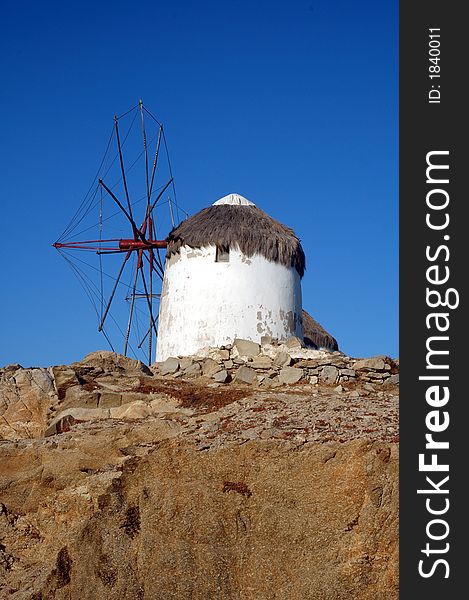 Traditional windmill on the Greek island of Mykonos. Traditional windmill on the Greek island of Mykonos