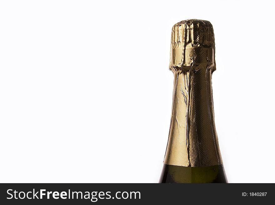 Champagne bottle close up in white background.