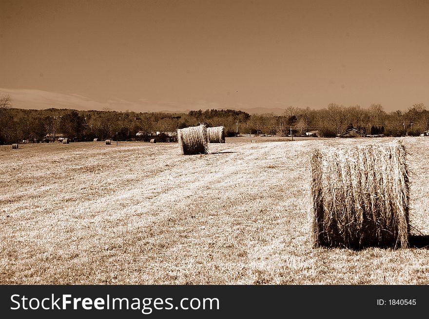 A closeup of a hay roll in sepia tones. A closeup of a hay roll in sepia tones