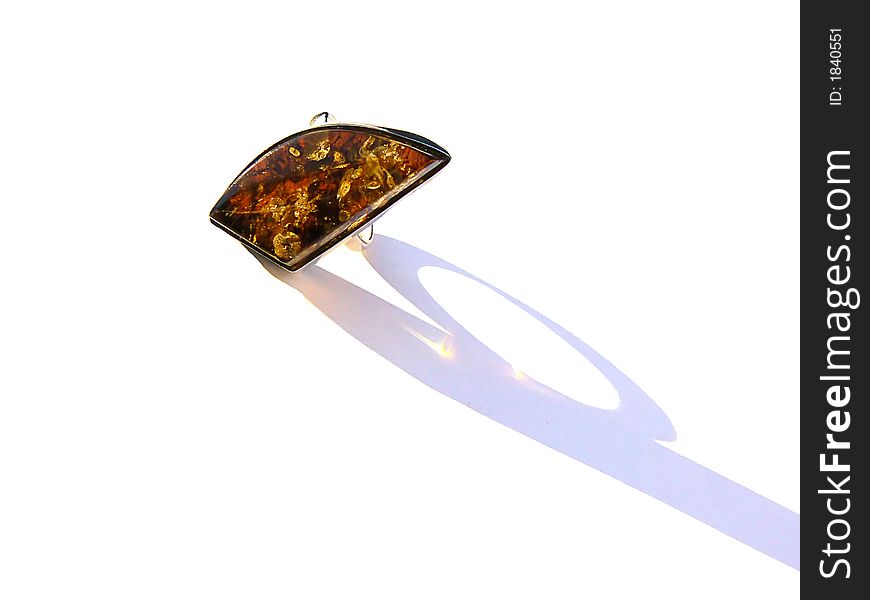 Silver ring with amber stone, over white