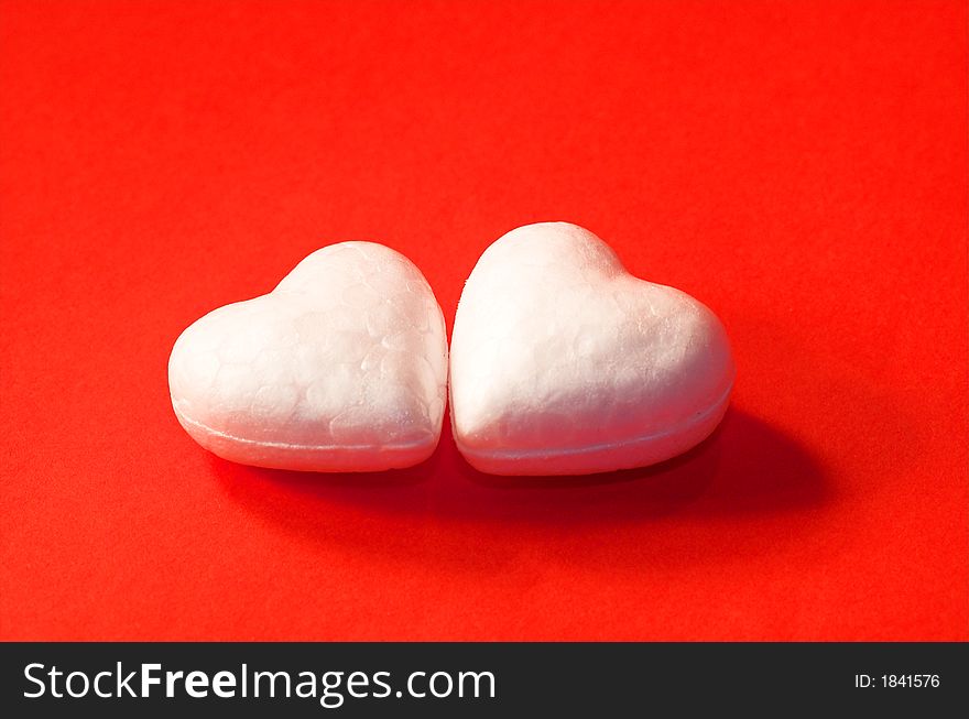 Two white hearts on red background. Two white hearts on red background