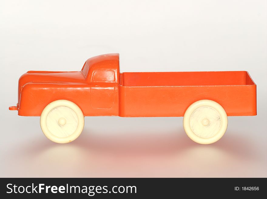 Nice orange plastic toy truck sideview