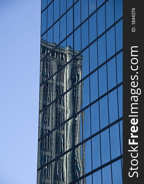 The John Hancock Tower in Boston, MA, USA on a clear sunny day. The John Hancock Tower in Boston, MA, USA on a clear sunny day
