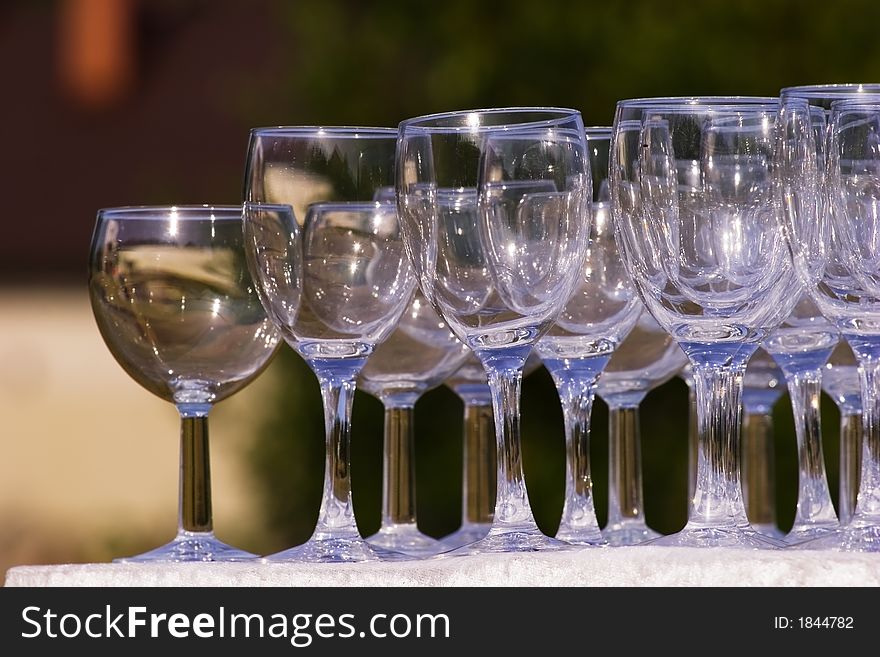 Arranged empty champagne (wine) glasses. Summer, outdoors. Arranged empty champagne (wine) glasses. Summer, outdoors.