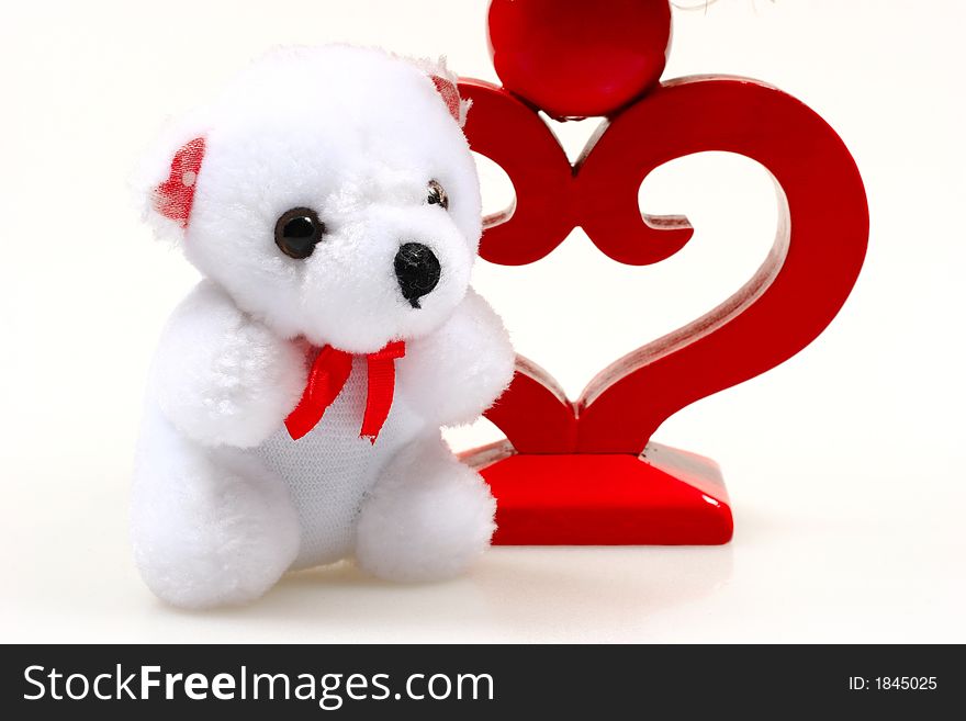 Teddy bear and candlestick isolated on white background