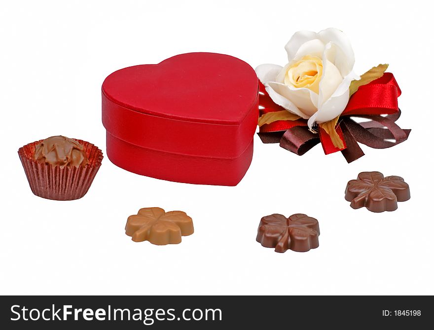Valentine still life with chocolates heart shape box and rose over white background. Valentine still life with chocolates heart shape box and rose over white background.