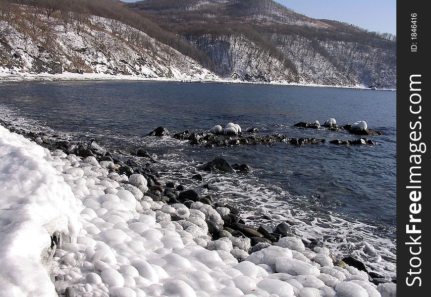 Stones an ice ocean a frost the nature winter the sea. Stones an ice ocean a frost the nature winter the sea