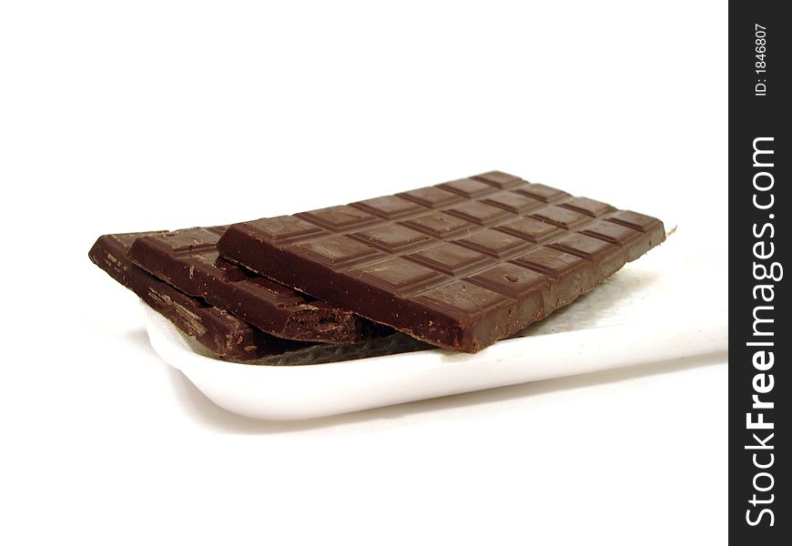 Chocolate on a plate over white background