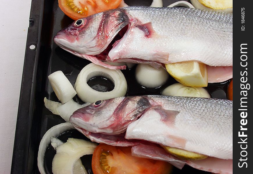 Two fresh sea bass ready for cook on oven. Two fresh sea bass ready for cook on oven