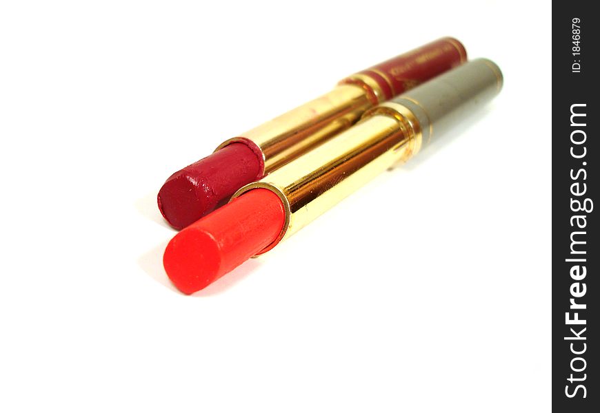 Two red lipstick on white background