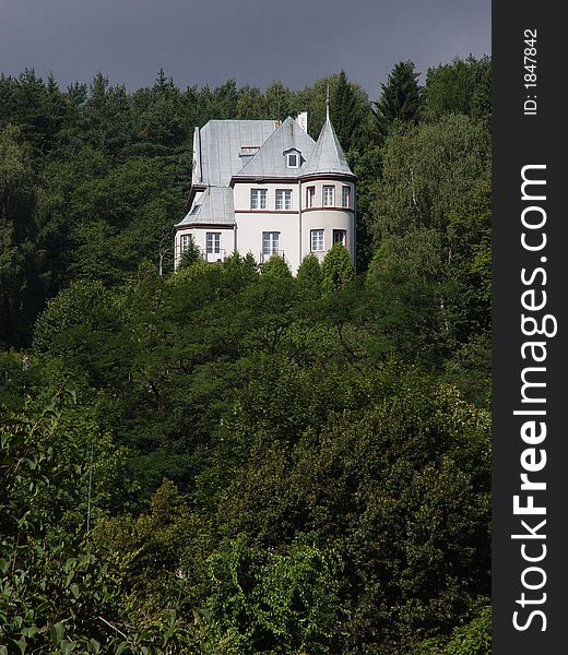 Home in mountain, green forest