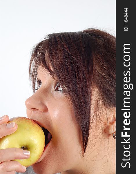 Attractive woman eating apple on white background. Attractive woman eating apple on white background