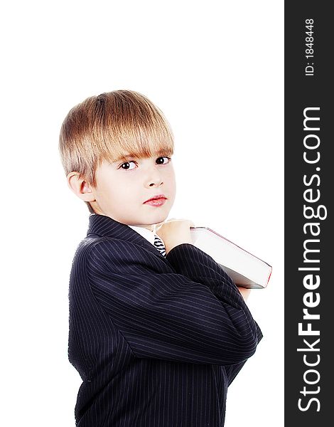 A young boy with his books, against white background. A young boy with his books, against white background.