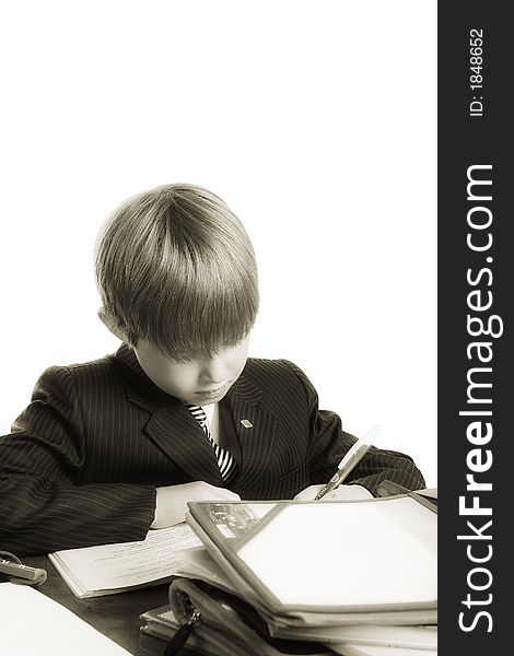 Close-up of boy in business suit. Shot in studio. Isolated with clipping path. Close-up of boy in business suit. Shot in studio. Isolated with clipping path.