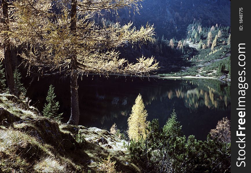 Small lake high up in the mountains, in the clear light of autumn mornings. Small lake high up in the mountains, in the clear light of autumn mornings