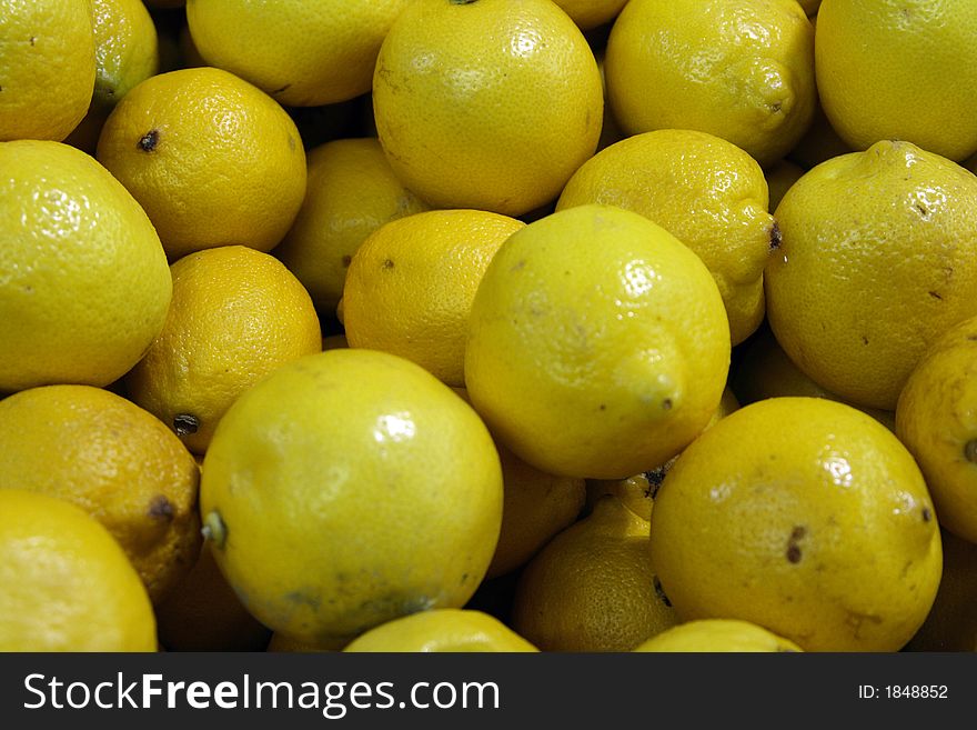 Lemons for sale at a local fruit and vegetable market. Lemons for sale at a local fruit and vegetable market