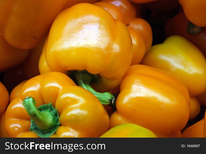 Bright yellow peppers available at a local market