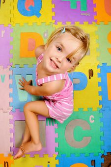 Child Learning The Alphabet Is Happy Stock Photo