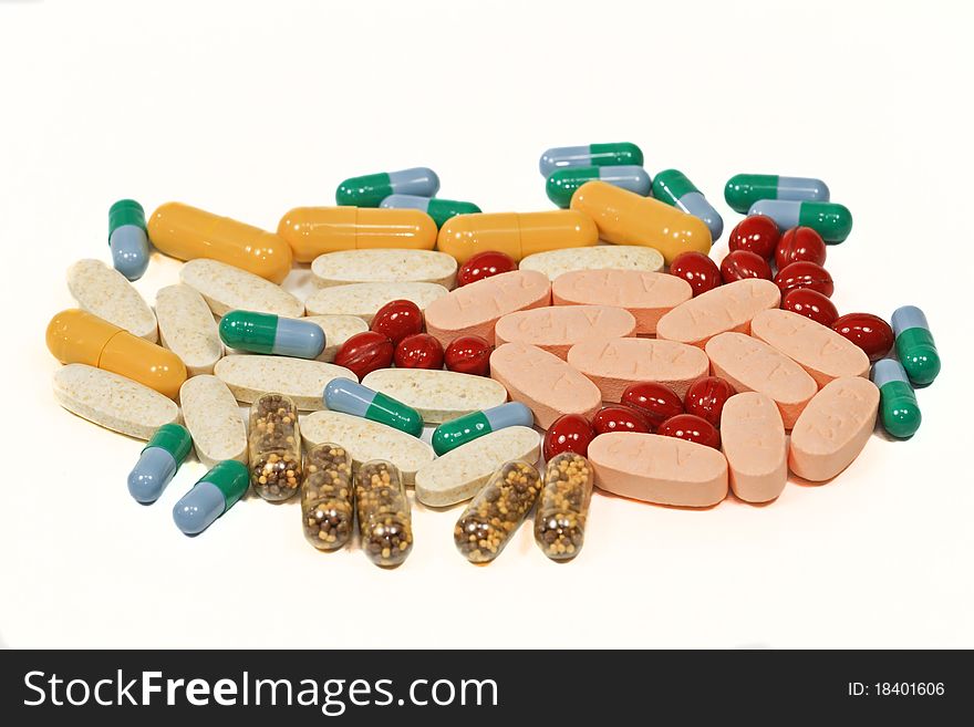 Vitamins, pills and tablets isolated on white background