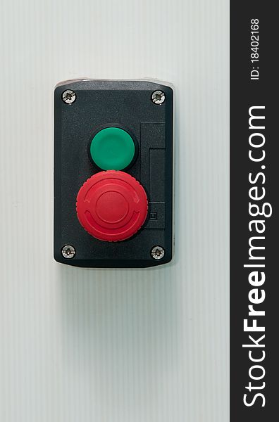 A portrait of emergency button with tile background