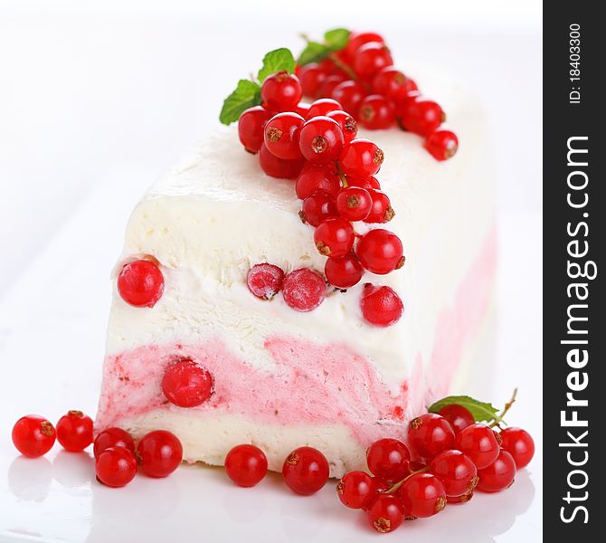 Ice cream parfait with redcurrants on white background