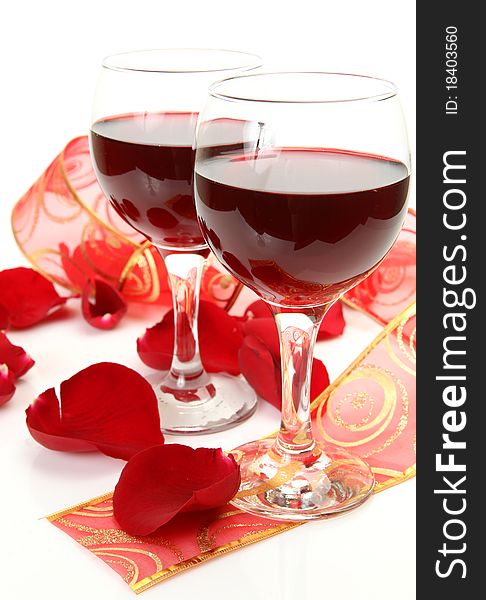 Wine and roses on a white background