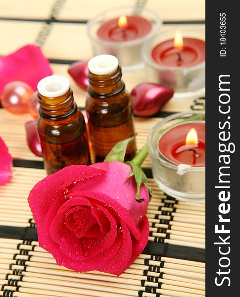 Aromatic oil and burning candles. Aromatic oil and burning candles
