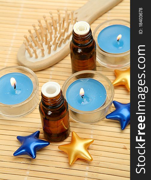 Aromatic oil and burning candles. Aromatic oil and burning candles
