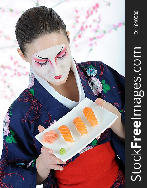 Beautiful japan geisha woman with sushi