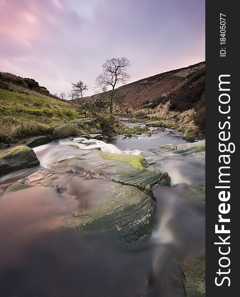 Waterfall on moorland cascading over rocks. Waterfall on moorland cascading over rocks