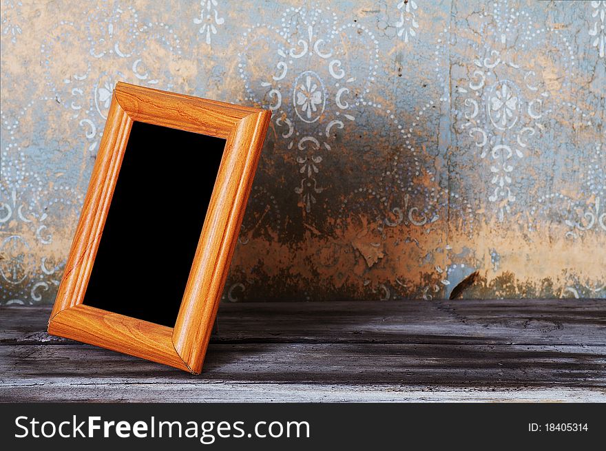 Vintage photo frame on old table. Vintage photo frame on old table