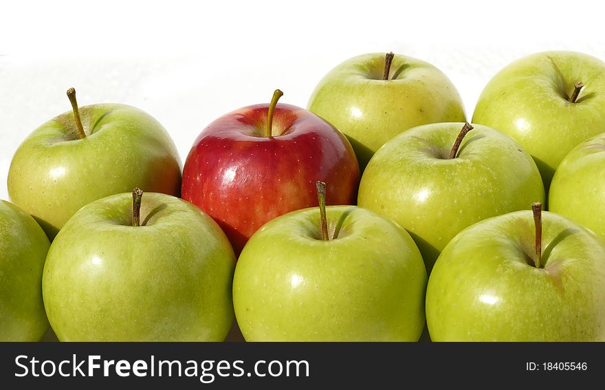 Green and red apples on a white background
