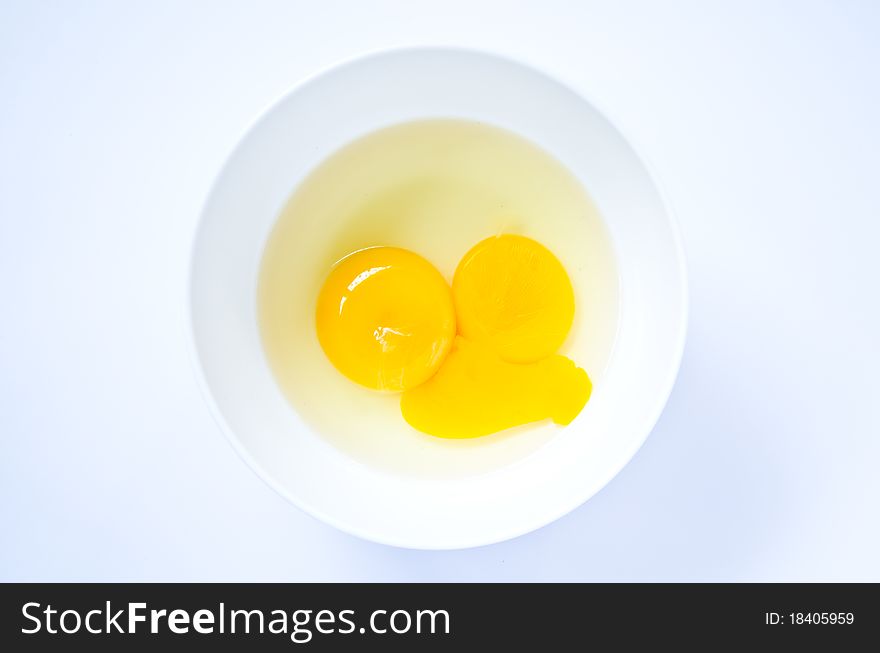 Raw egg in the cup for cooking. Raw egg in the cup for cooking.