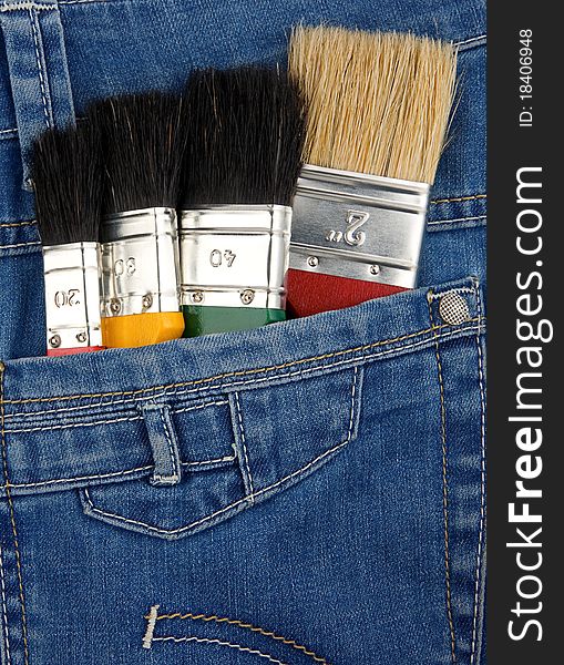 Paintbrushes on jeans texture