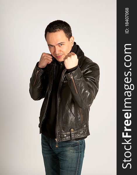 Tough Man In Leather Jacket In Fighting Pose