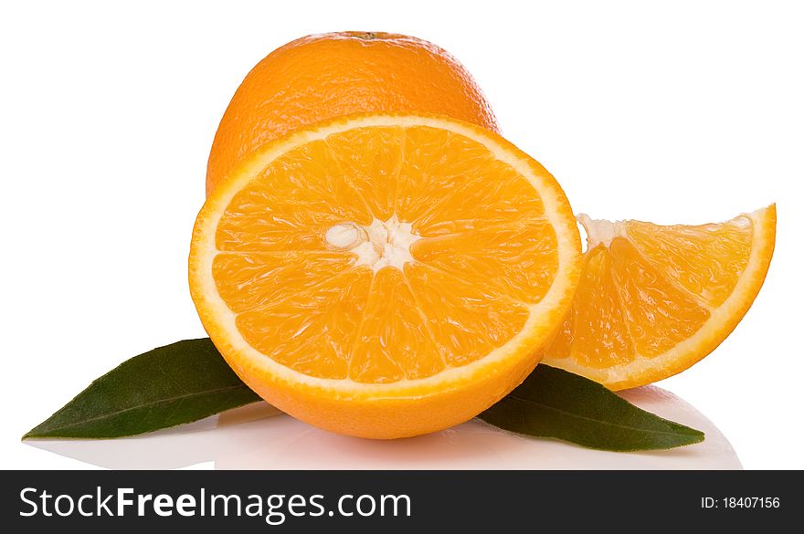 Oranges And Green Leaves Isolated On White