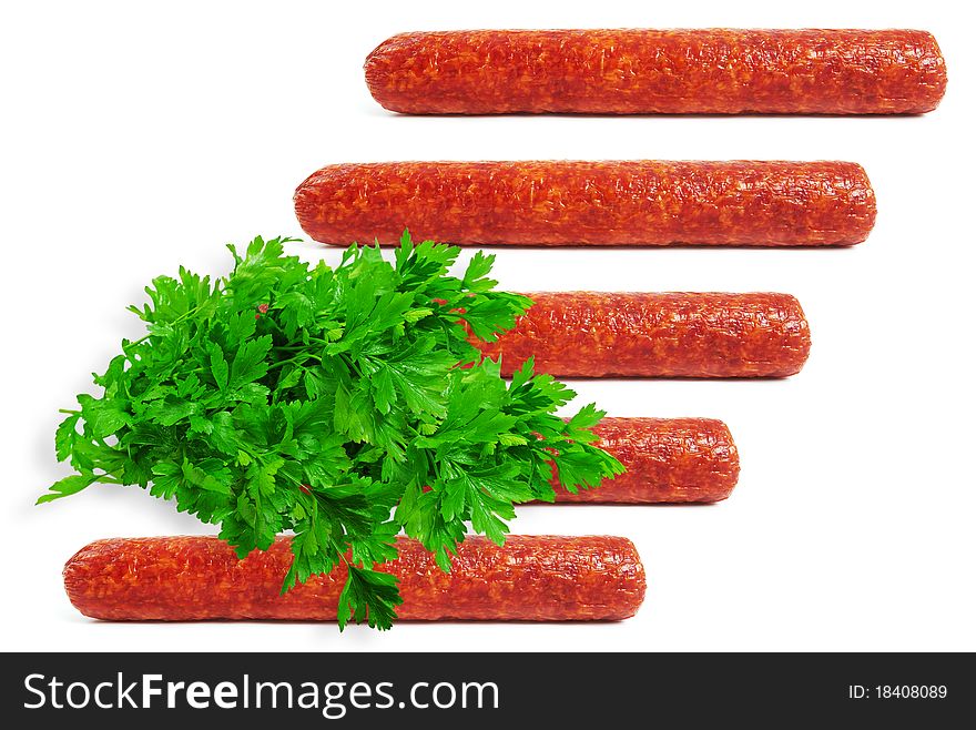 Five sausages on a white background with banch of green parsley. Five sausages on a white background with banch of green parsley.