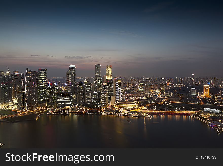 Singapore night view just before the sunset. Perfect view of Singapore busy financial district and tourist attractions.