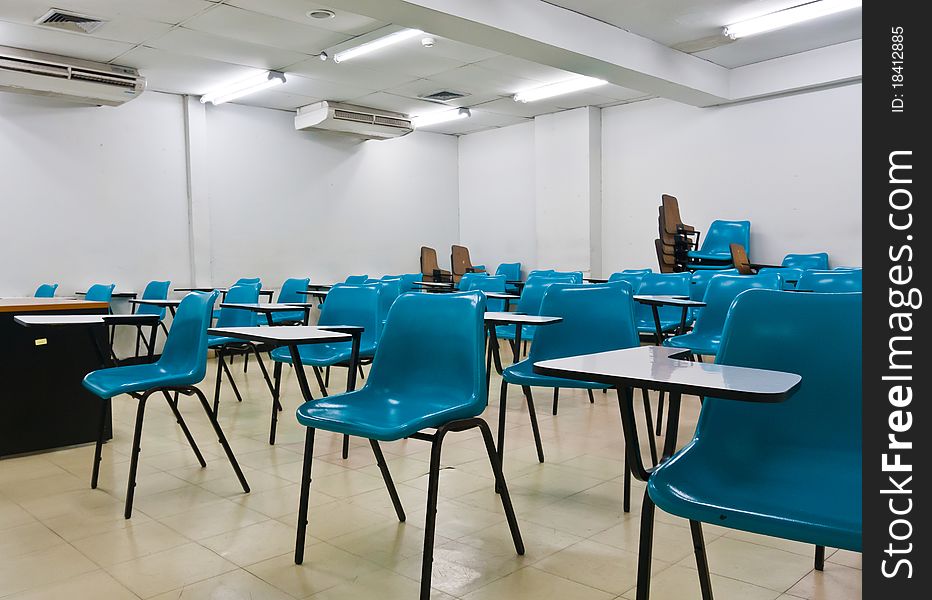 Empty room wth many armchairs can be use as classroom or metting room