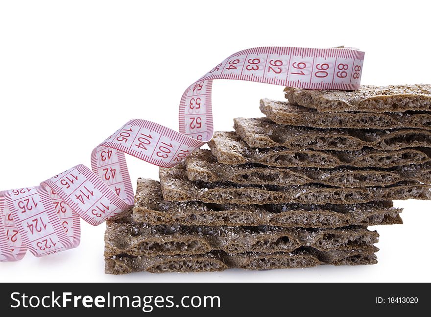 Stack of brown crisp with metre for waist. Stack of brown crisp with metre for waist